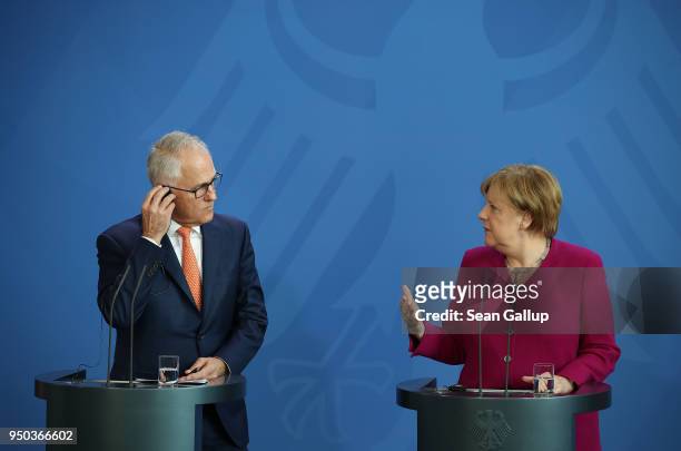 German Chancellor Angela Merkel and Australian Prime Minister Malcolm Turnbull speak to the media prior to talks at the Chancellery on April 23, 2018...