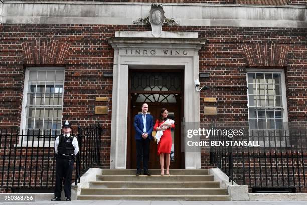 Britain's Prince William, Duke of Cambridge and Britain's Catherine, Duchess of Cambridge aka Kate Middleton show their newly-born son, their third...