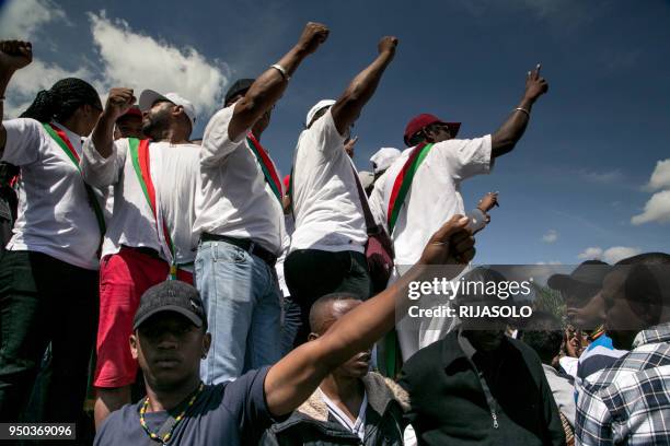 Opposition supporters and deputies shout slogans as they gather at "May 13 Square" in Antananarivo on April 23 to offer their condolences to the...