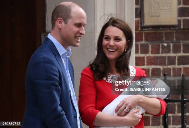 Britain's Prince William, Duke of Cambridge and Britain's Catherine, Duchess of Cambridge aka Kate Middleton show their newly-born son, their third...