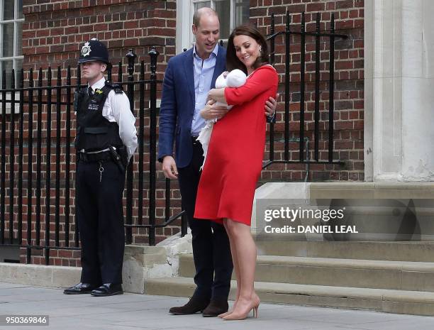 Britain's Prince William, Duke of Cambridge and Britain's Catherine, Duchess of Cambridge aka Kate Middleton show their newly-born son, their third...