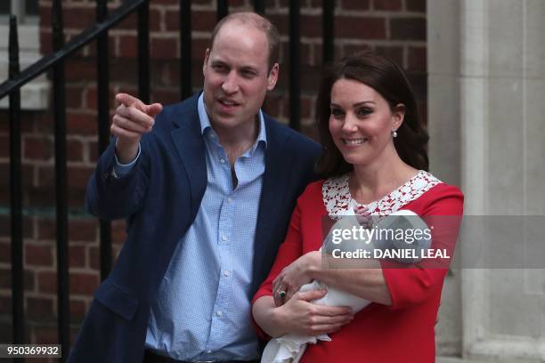 Britain's Prince William, Duke of Cambridge and Britain's Catherine, Duchess of Cambridge aka Kate Middleton show their newly-born son, their third...