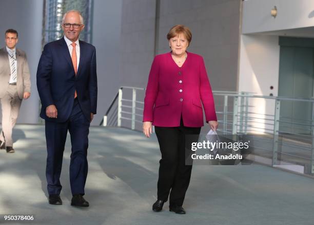 German Chancellor Angela Merkel and Australian Prime Minister Malcolm Turnbull arrive for the joint press conference ahead of their meeting at the...