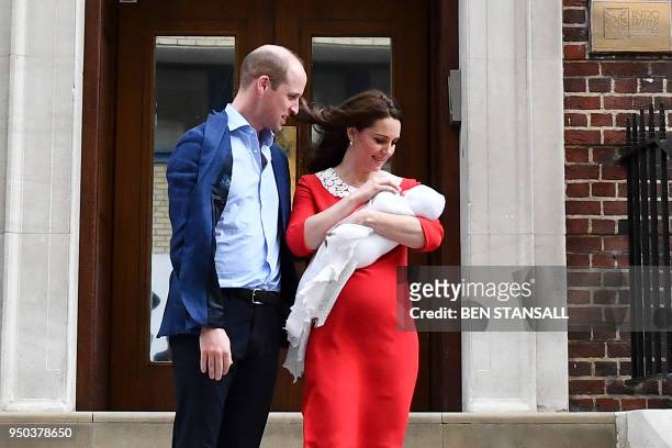 Britain's Prince William, Duke of Cambridge and Britain's Catherine, Duchess of Cambridge aka Kate Middleton show their newly-born son, their third...