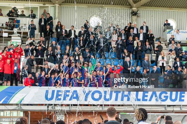 The FC Barcelona team celebrates with the trophy during the UEFA Youth League Final match between Chelsea FC and FC Barcelona at Colovray Sports...