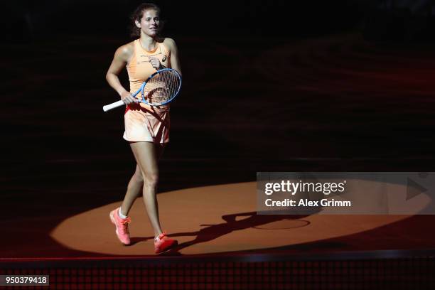 Julia Goerges of Germany enters the court for a show event on day 1 of the Porsche Tennis Grand Prix at Porsche-Arena on April 23, 2018 in Stuttgart,...