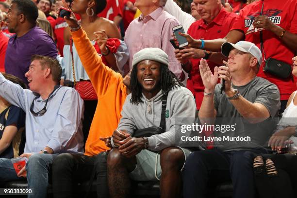 Alvin Kamara attends Game Three of Round One between the Portland Trail Blazers and the New Orleans Pelicans during the 2018 NBA Playoffs on April...