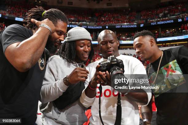 Cameron Jordan, Alvin Kamara, Chris Banjo, and Damarious Randall attend Game Three of Round One between the Portland Trail Blazers and the New...