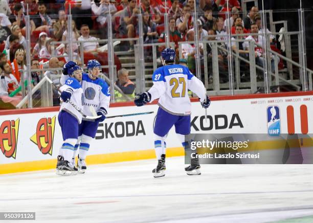 Yevgeni Rymarev of Kazakhstan celebrates his goal with teammates during the 2018 IIHF Ice Hockey World Championship Division I Group A match between...