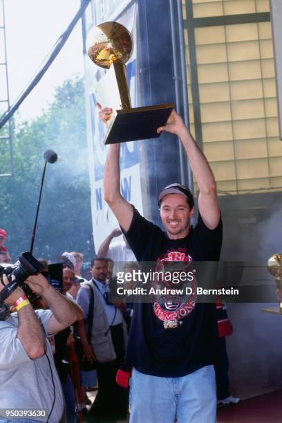 Toni Kukoc of the Chicago Bulls holds up the Larry O'Brien NBA Championship Trophy during the 1998 Chicago Bulls Celebration Rally on June 16, 1998...