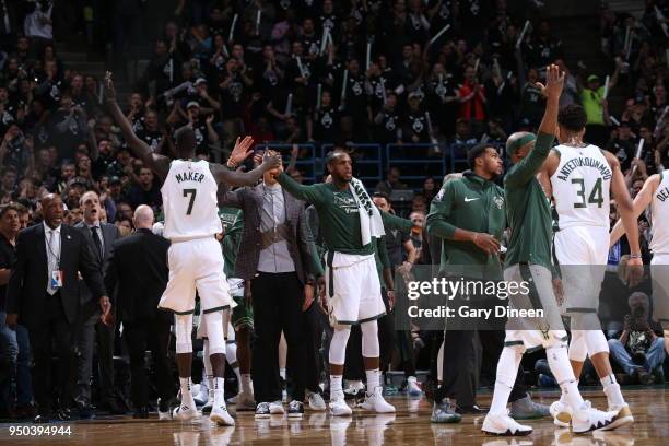 Khris Middleton of the Milwaukee Bucks celebrates with his teammates against the Boston Celtics in Game Four of Round One of the 2018 NBA Playoffs on...