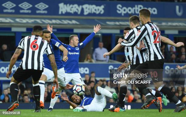 Everton's English striker Wayne Rooney appeals for a penalty after Everton's English striker Theo Walcott was tackled in the six yard box during the...