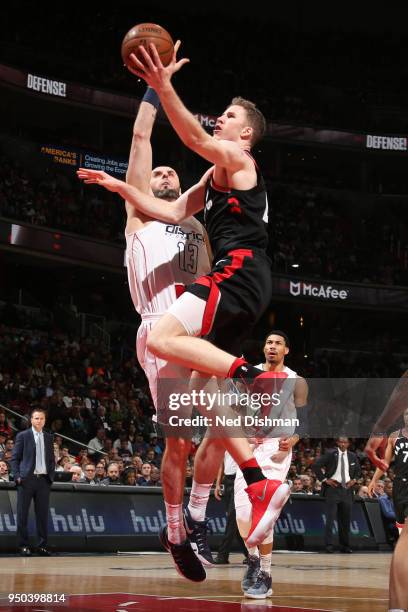 Jakob Poeltl of the Toronto Raptors goes to the basket against the Washington Wizards in Game Four of Round One of the 2018 NBA Playoffs on April 22,...