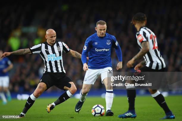 Wayne Rooney of Everton and Jonjo Shelvey of Newcastle United battle for possession during the Premier League match between Everton and Newcastle...