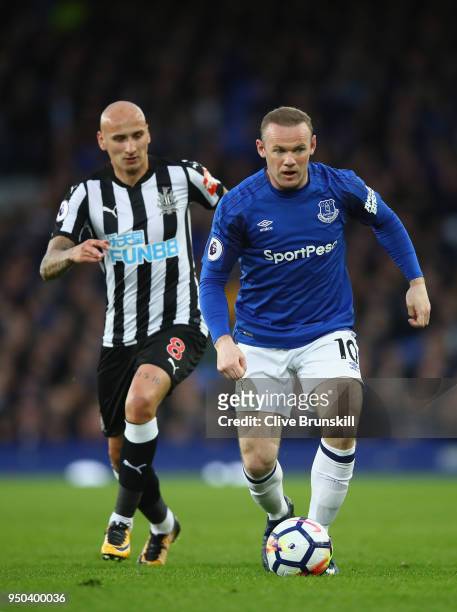 Wayne Rooney of Everton and Jonjo Shelvey of Newcastle United battle for possession during the Premier League match between Everton and Newcastle...