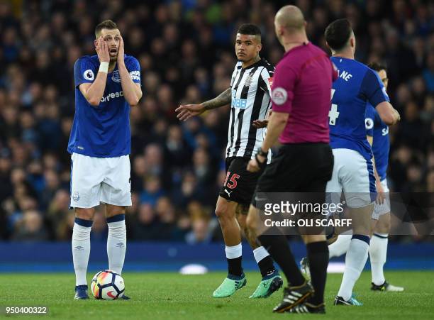 Everton's French midfielder Morgan Schneiderlin reacts as English referee Bobby Madley awards a free-kick to Newcastle during the English Premier...
