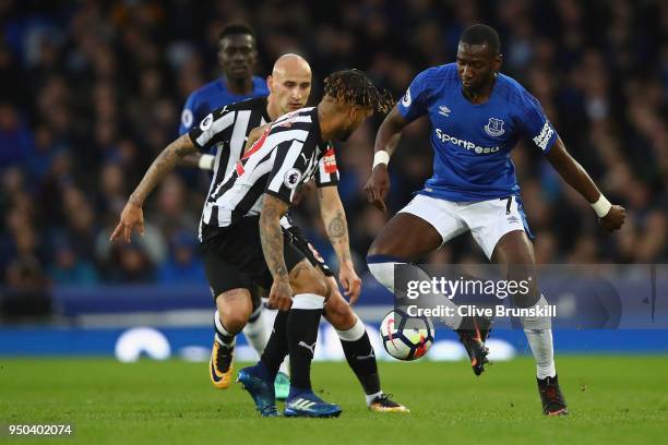 Yannick Bolasie of Everton, Jonjo Shelvey of Newcastle United and Deandre Yedlin of Newcastle United battle for possession during the Premier League...