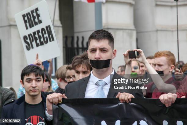 Protester covers mouth with black tape as an action to call for free speech in London, on 23 April 2018 to protest Free Speech Laws that saw Dankula...