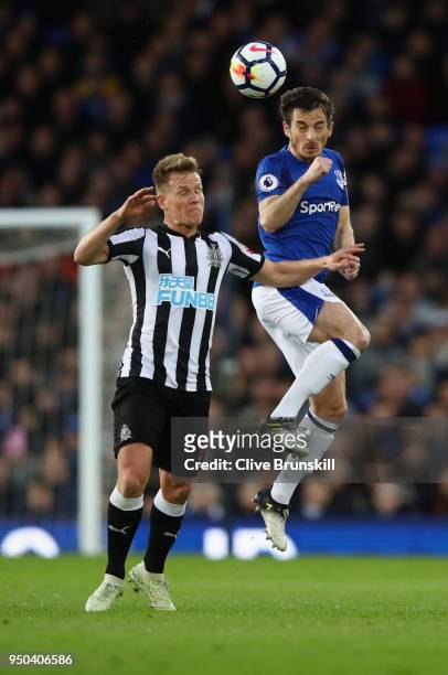 Leighton Baines of Everton and Matt Ritchie of Newcastle United battle for possession in the air during the Premier League match between Everton and...
