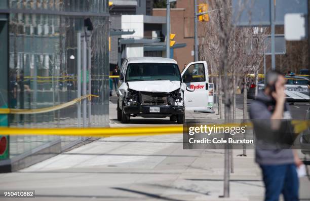 Police inspect a van suspected of being involved in a collision injuring at least eight people at Yonge St. And Finch Ave. On April 23, 2018 in...