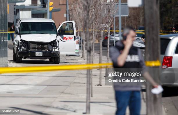 Police inspect a van suspected of being involved in a collision injuring at least eight people at Yonge St. And Finch Ave. On April 23, 2018 in...