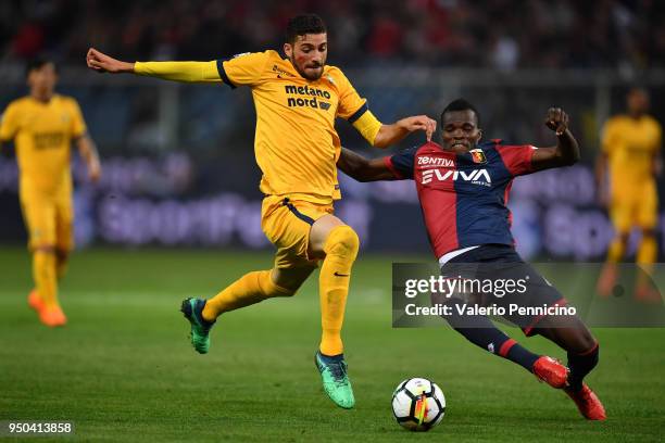 Isaac Cofie of Genoa CFC tackles Mattia Valoti of Hellas Verona FC during the Serie A match between Genoa CFC and Hellas Verona FC at Stadio Luigi...