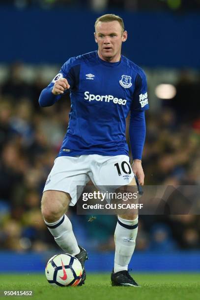 Everton's English striker Wayne Rooney controls the ball during the English Premier League football match between Everton and Newcastle United at...