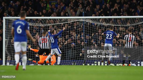 Theo Walcott of Everton scores his sides first goal during the Premier League match between Everton and Newcastle United at Goodison Park on April...