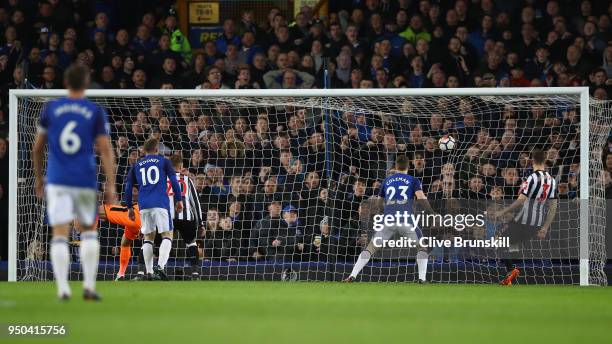 Theo Walcott of Everton scores his sides first goal during the Premier League match between Everton and Newcastle United at Goodison Park on April...