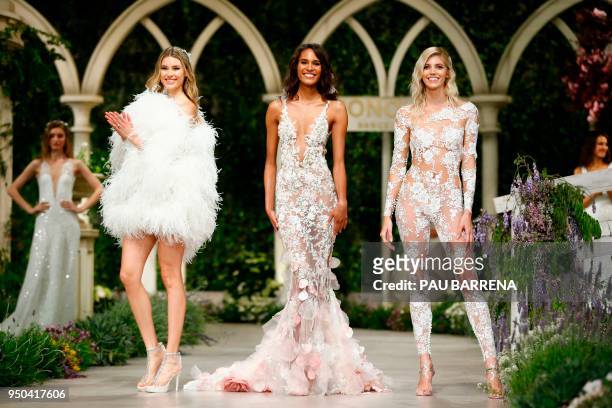 French model Cindy Bruna presents a creation of the Pronovias 2019 collection during the Barcelona Bridal Week in Barcelona, on April 23, 2018.