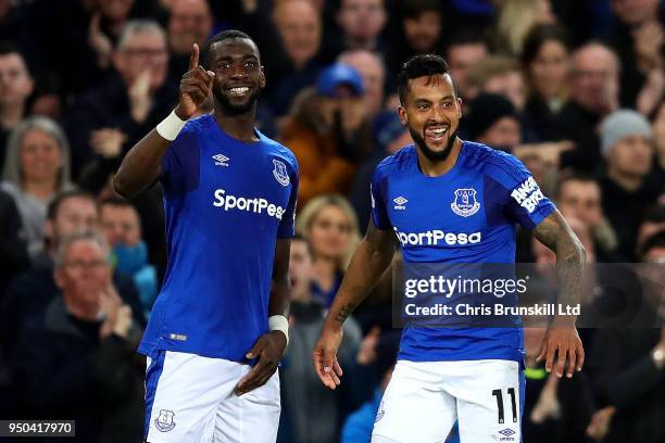 Theo Walcott of Everton celebrates scoring the opening goal with team-mate Yannick Bolasie during the Premier League match between Everton and...