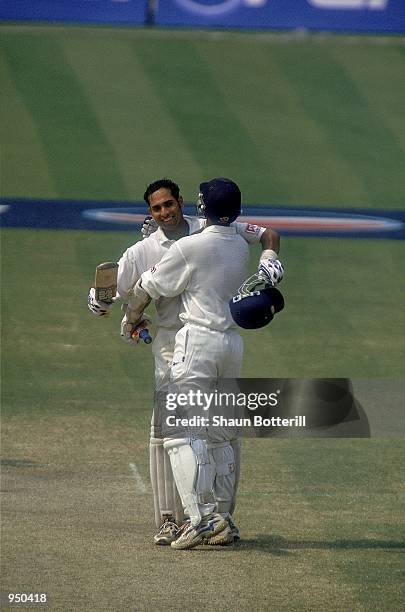 Laxman of India is congratulated on reaching his double century by team mate Rahul Dravid during the Second Test match against Australia played at...