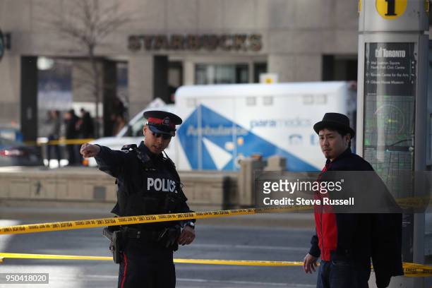 As the Police investigate a van that ran down pedestrians along Yonge Street between Sheppard and Finch streets in Toronto at the Air Canada Centre...