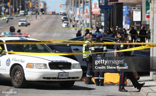 Police have Yonge Street blocked off at Parkview Avenue where on of the victims lies on the East side of the street as the Police investigate a van...