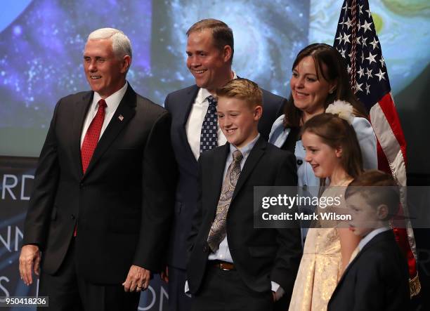 Vice President Mike Pence , stands with Jim Bridenstine, his wife, Michelle, daughter Sarah, and sons Walker and Grant, during Bridenstine's...