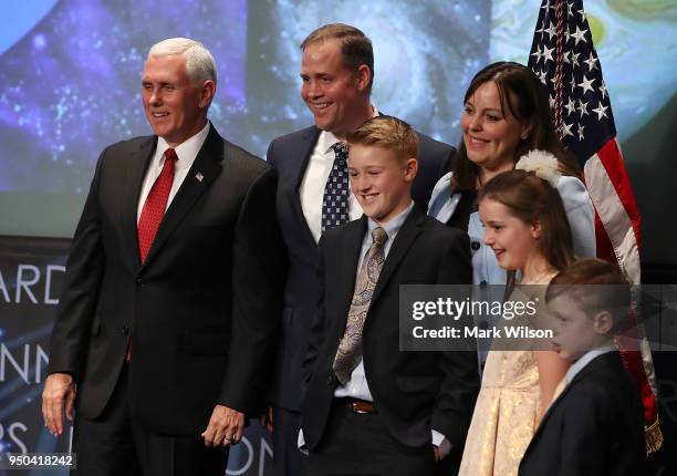 Vice President Mike Pence , stands with Jim Bridenstine, his wife, Michelle, daughter Sarah, and sons Walker and Grant, during Bridenstine's...