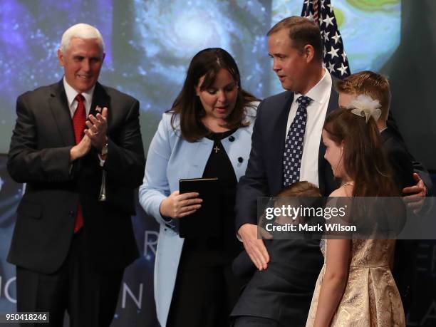 Vice President Mike Pence , stands with Jim Bridenstine, his wife, Michelle, daughter Sarah, and sons Walker and Grant, during Bridenstine's...