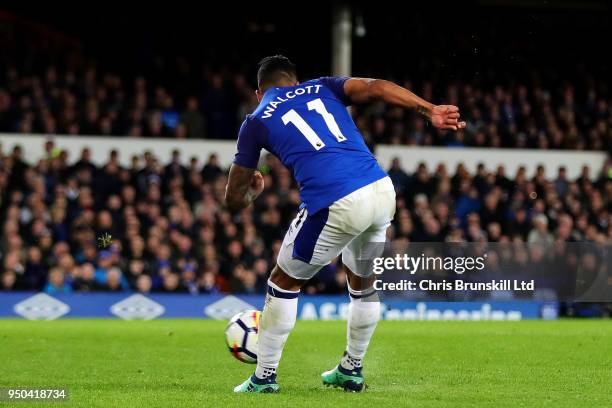 Theo Walcott of Everton scores the opening goal during the Premier League match between Everton and Newcastle United at Goodison Park on April 23,...