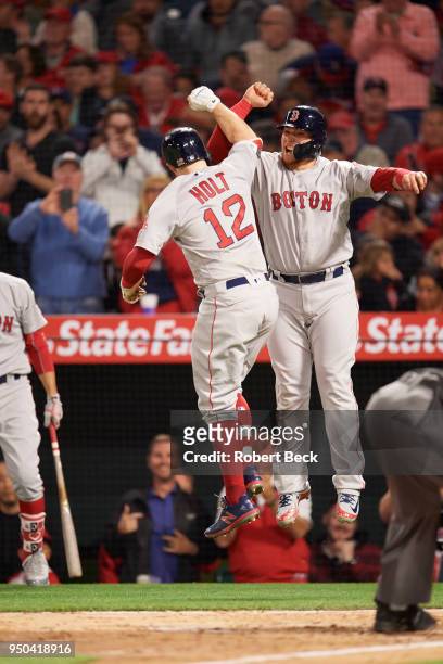 Rear view of Boston Red Sox Brock Holt victorious with Christian Vazquez during game vs Los Angeles Angels at Angel Stadium. Anaheim, CA 4/17/2018...
