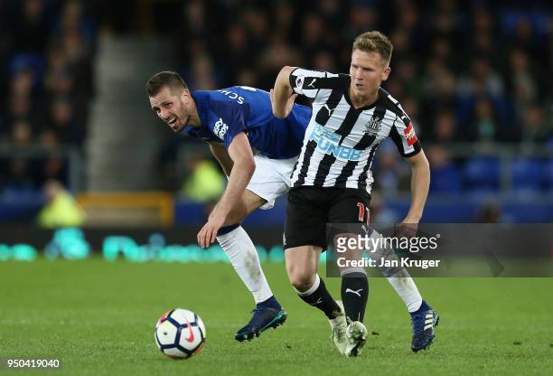 Morgan Schneiderlin of Everton and Matt Ritchie of Newcastle United battle for possession which injures Matt Ritchie during the Premier League match...