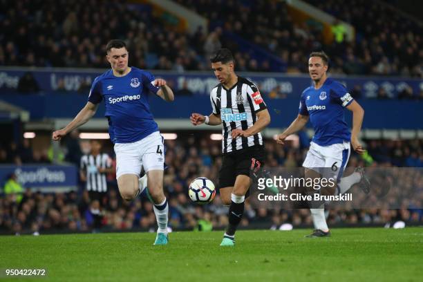 Ayoze Perez of Newcastle United, Michael Keane of Everton and Phil Jagielka of Everton in action during the Premier League match between Everton and...