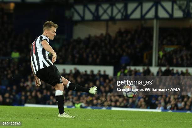 Matt Ritchie of Newcastle United sends a free kick over the bar during the Premier League match between Everton and Newcastle United at Goodison Park...