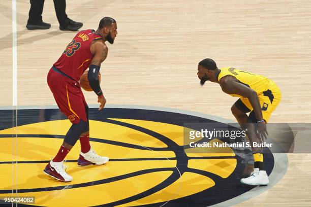 LeBron James of the Cleveland Cavaliers handles the ball against Lance Stephenson of the Indiana Pacers in Game Three of Round One of the 2018 NBA...