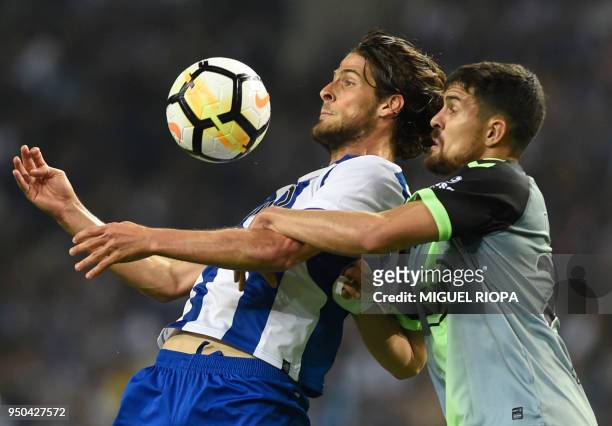 Porto's Portuguese forward Goncalo Paciencia controls the ball next to Vitoria FC's Portuguese defender Nuno Reis during the Portuguese league...