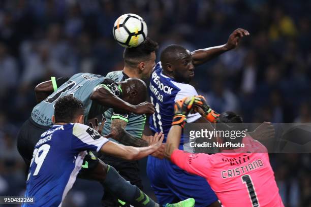 Porto's Malian forward Moussa Marega vies with Vitoria Setubal's Portuguese forward Edinho and Vitoria Setubal's Portuguese goalkeeper Cristiano...