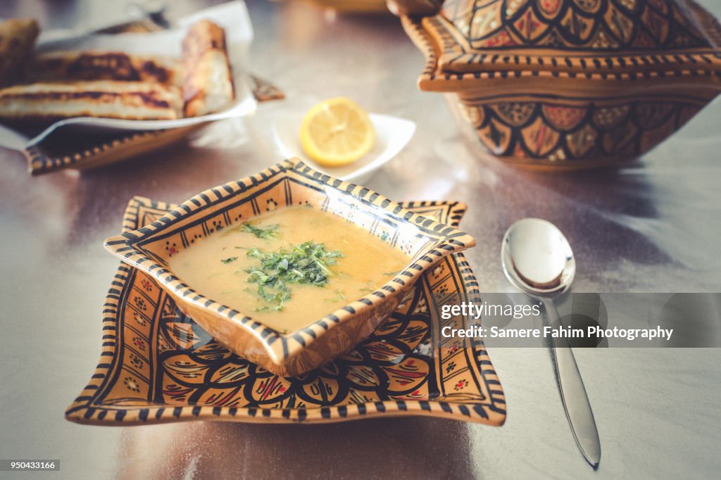 Harira soup served on bowl with bourak (brik)
