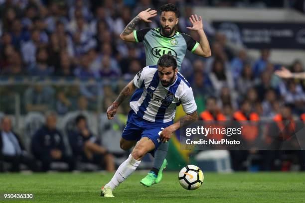Porto's Portuguese midfielder Sergio Oliveira vies with Vitoria Setubal's Portuguese midfielder Joao Costinha during the Premier League 2016/17 match...
