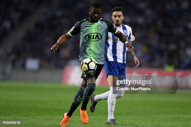 Vitoria Setubal's defender Arnold Issoko in action with Porto's Brazilian defender Alex Telles during the Premier League 2016/17 match between FC...