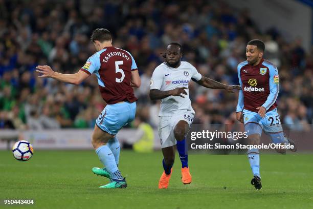 Victor Moses of Chelsea battles with James Tarkowski of Burnley and Aaron Lennon of Burnley during the Premier League match between Burnley and...