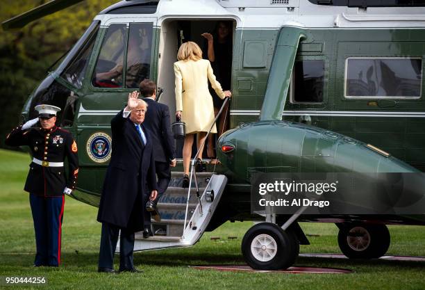 President Donald Trump waves as he boards Marine One before traveling to Mount Vernon with French President Emmanuel Macron and his wife Brigitte...